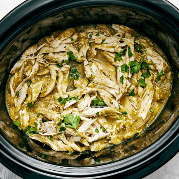 Salsa verde chicken in a slow cooker.