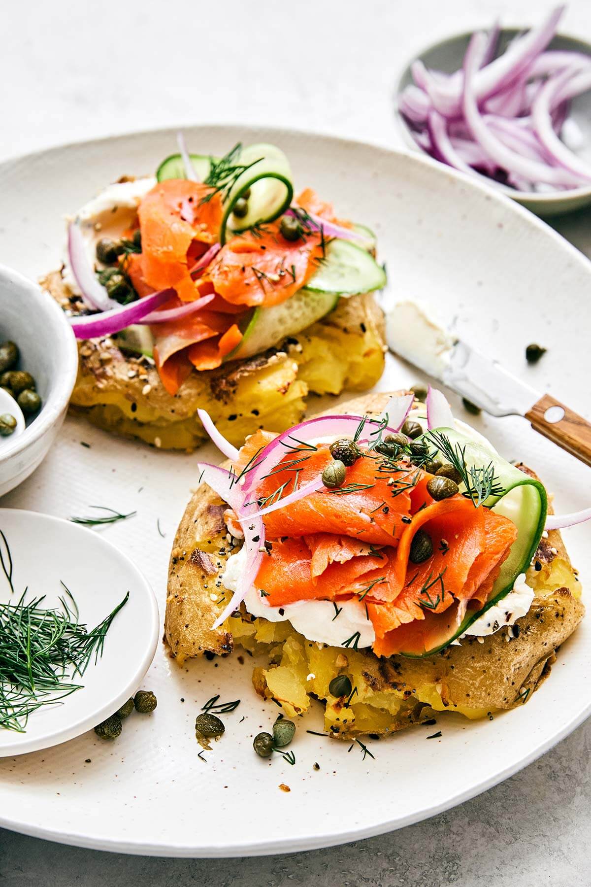 Smashed potatoes with lox toppings.