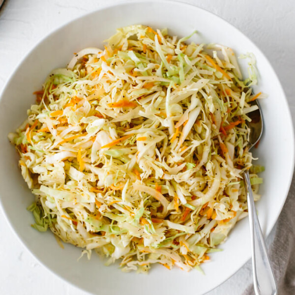 Vinegar coleslaw in a white bowl.