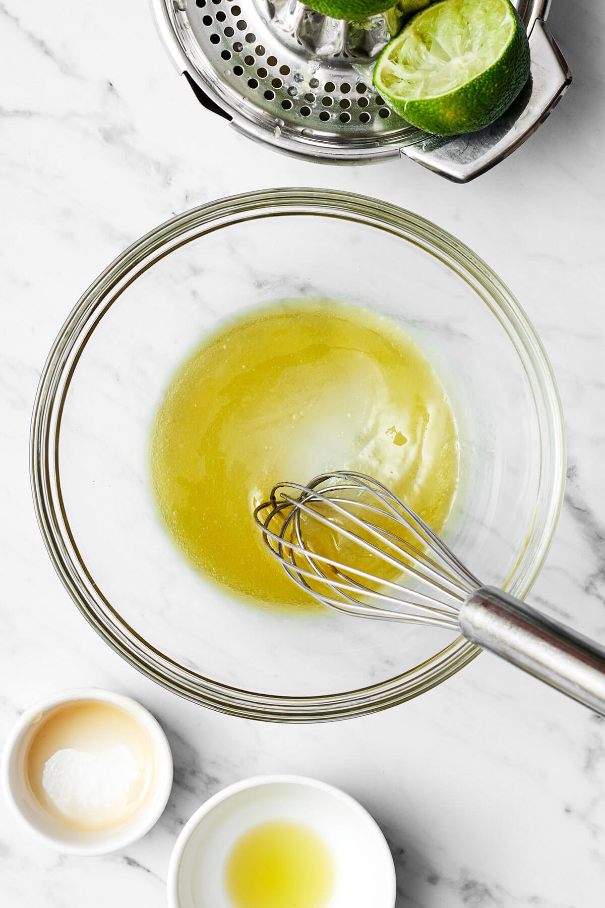 Mixing watermelon salad dressing in a bowl