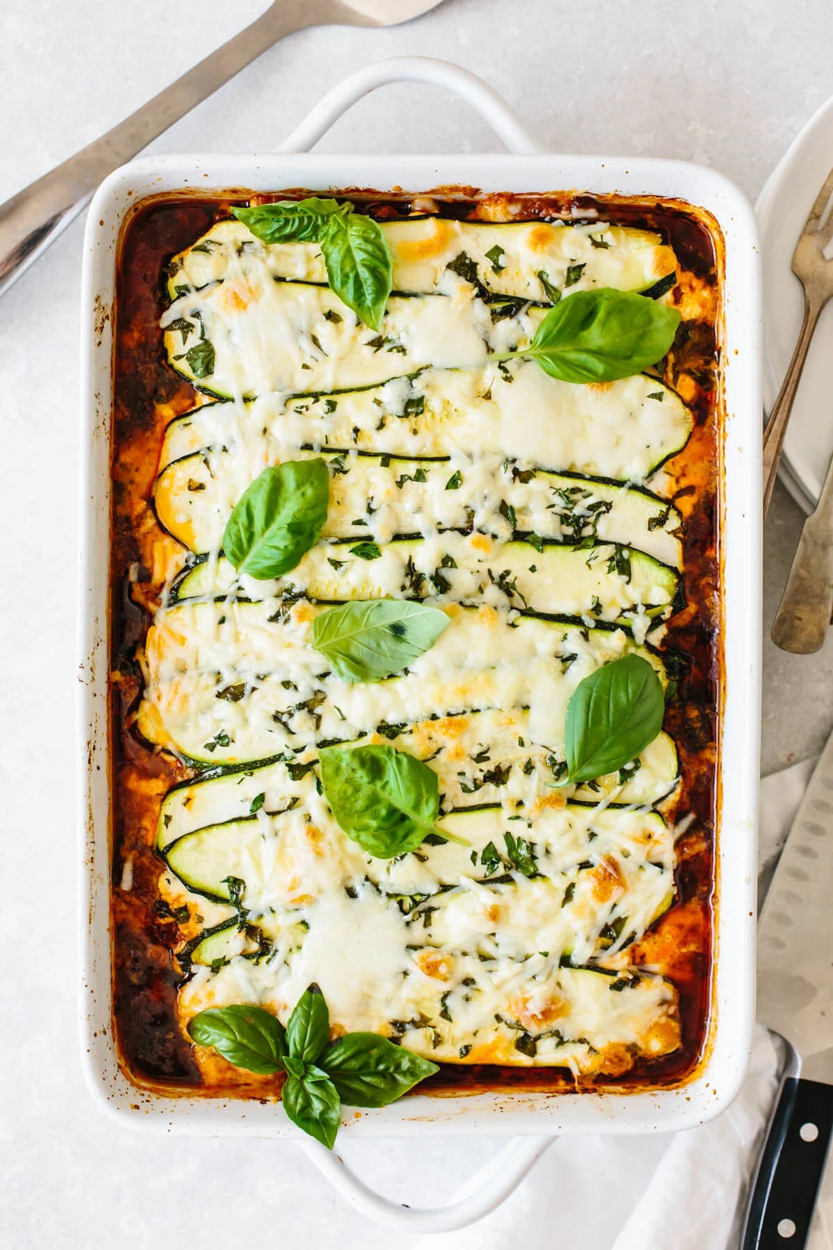 Zucchini lasagna with basil leaves