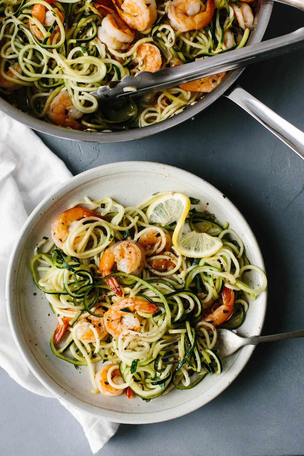 This zucchini pasta with lemon garlic shrimp is a delicious, gluten-free (and of course low-carb) version of shrimp scampi and linguini. Traditional pasta is replaced with zucchini noodles or zucchini pasta for a lighter, healthier meal.