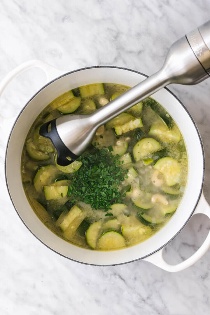 Blending up a zucchini soup with an immersion blender